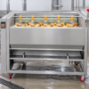 Potato Washing Machine in a commercial processing environment Potato Washing Machine in a commercial processing environment